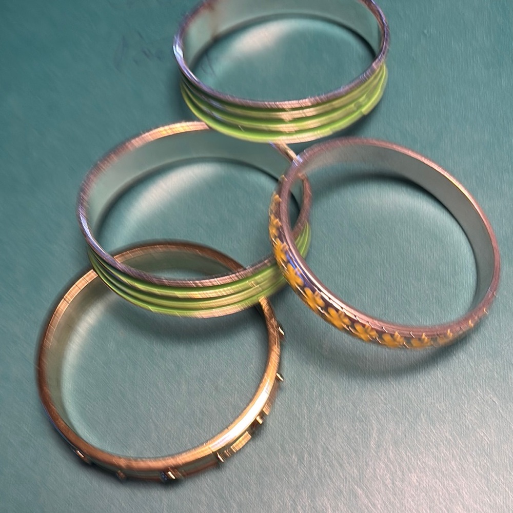 Set of Four  Silver Toned Bangles